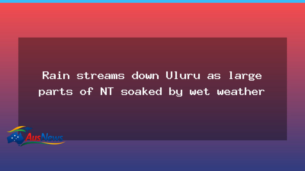 Rain streams down Uluru as the NT reels from wet weather - northern territory