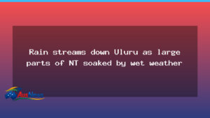 Rain streams down Uluru as the NT reels from wet weather - northern territory